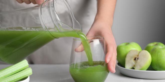 Celery juice being poured 
